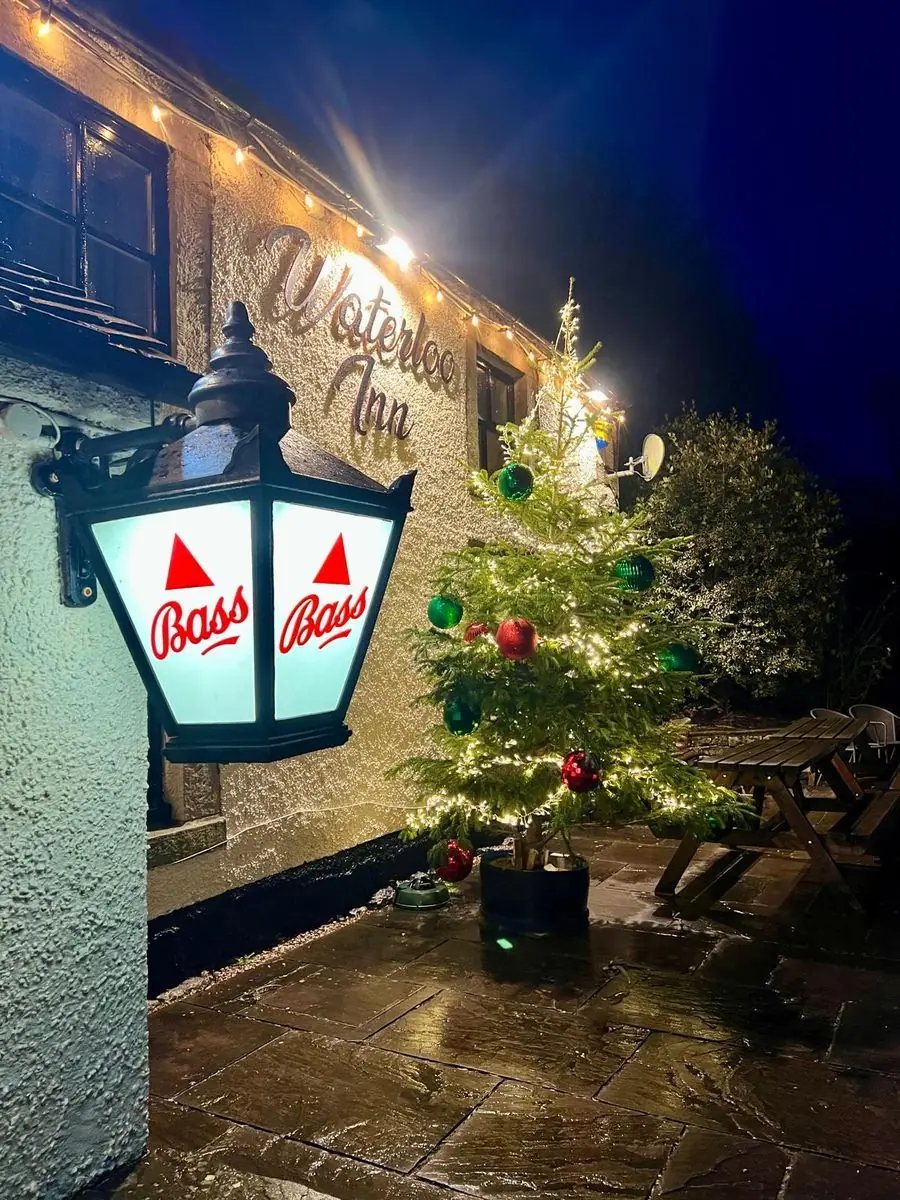Bass lantern outside The Waterloo Inn at night