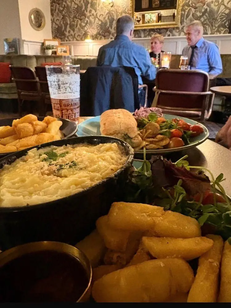 Home-cooked cottage pie with chips and salad